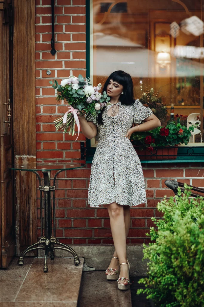 “Young girl holding bouquet of flowers